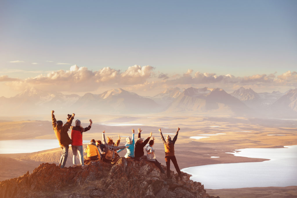 Group hiking in a beautiful landscape during an Airbnb Experience. 