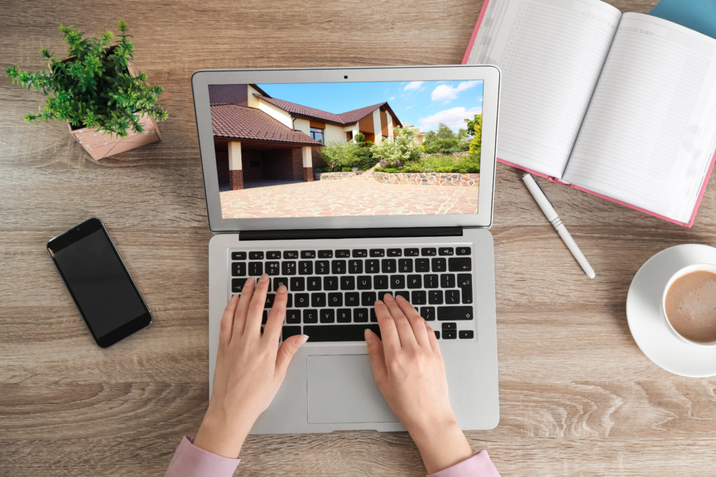 Person creating profile for short term rental property with stunning photos.